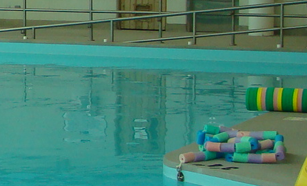 swimming pool, floating toys on the deck